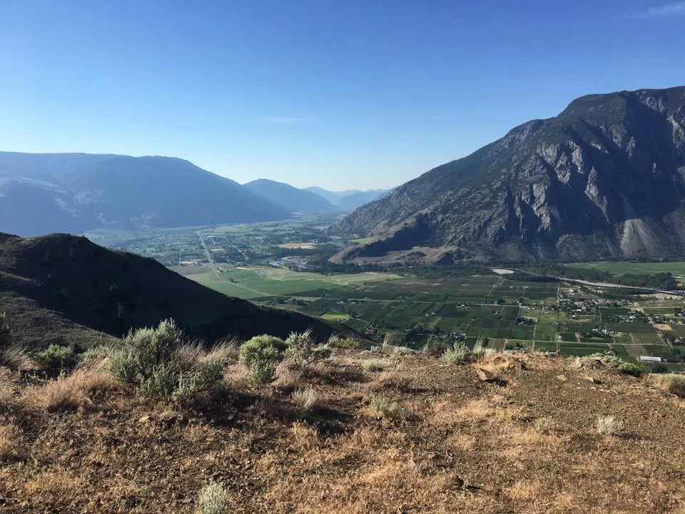 The Similkameen valley seen from the mountain above Keremeos, orchards and fields laid out below the dry ridges